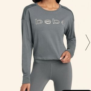 Bebe Women's Silver Sequin Logo Long Sleeve Charcoal Top with trim on the should